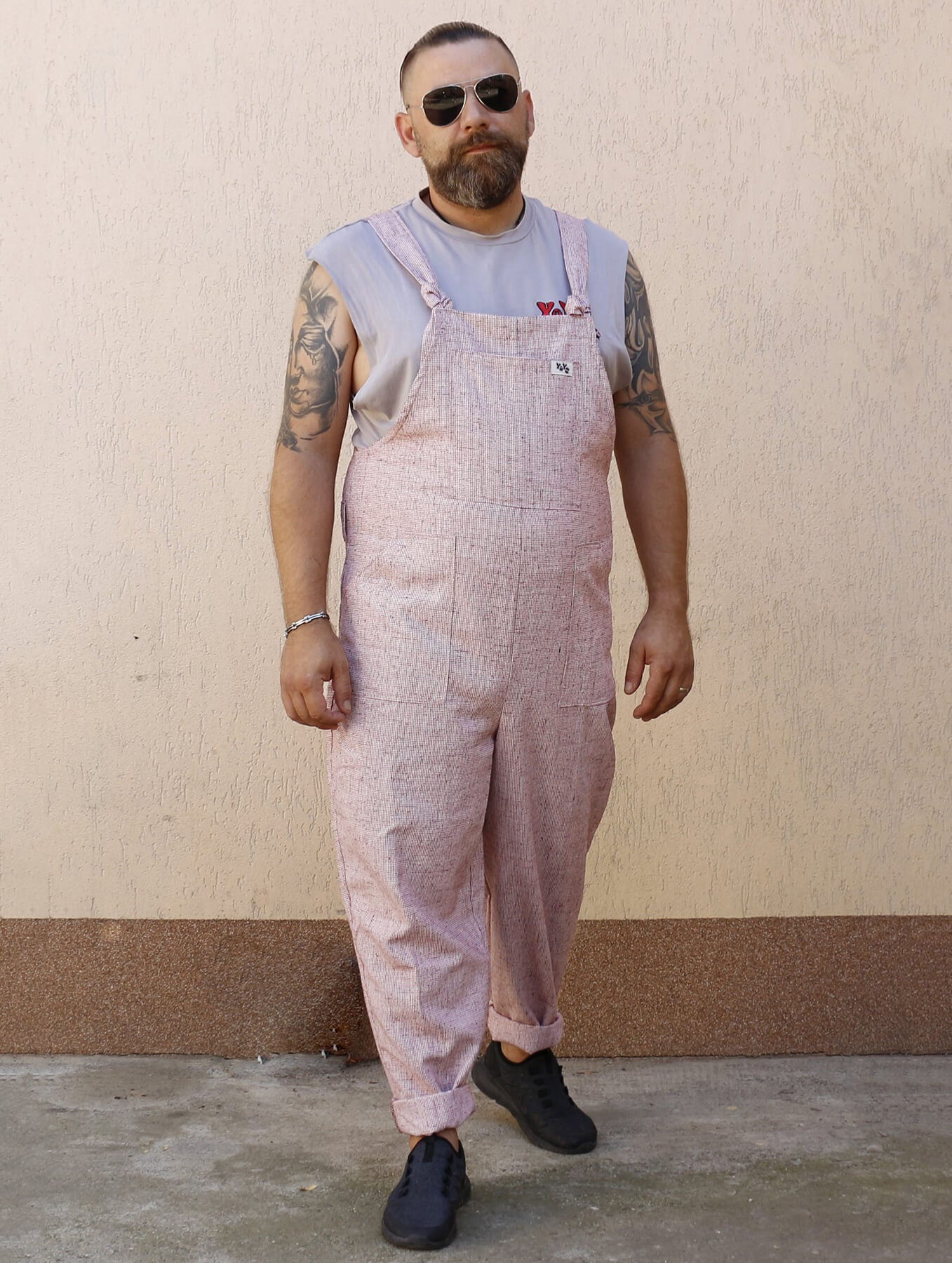 man wearing YAYS linen unisex dungarees in Pink Sand, posing front view